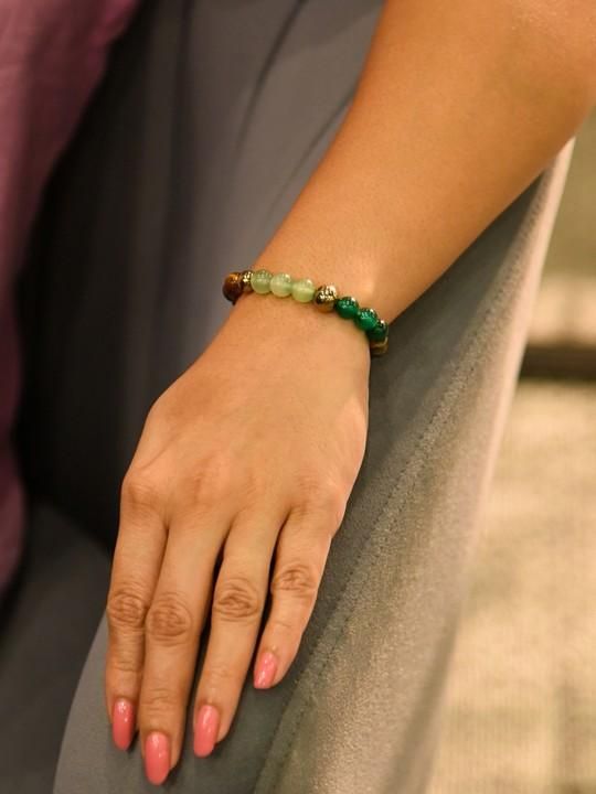Elasticated Dhan Yog bracelet by IndiKartNest featuring traditional beads and intricate design on a neutral background.